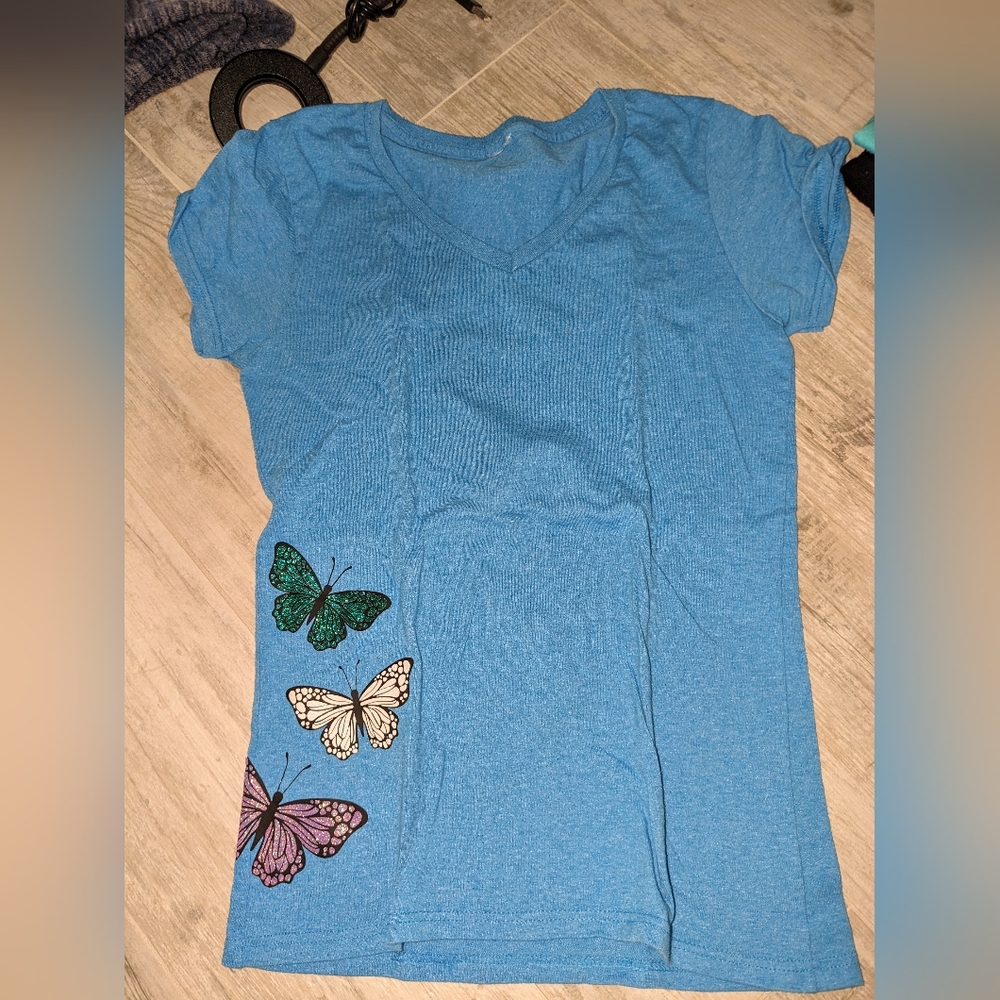 blue shirt with glitter butterflies